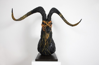 Illustration for article titled This Artist Turns Old Tires Into Dark, Disturbing Nightmare Monsters